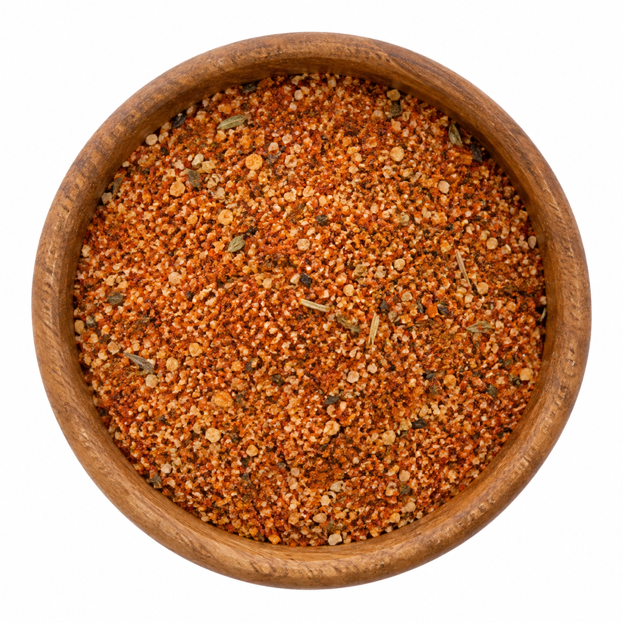 Cajun Creoolse kruidenmix in houten kom - Kruidenkaravaan Cajun kruidenmix met zout in houten kom op witte achtergrond