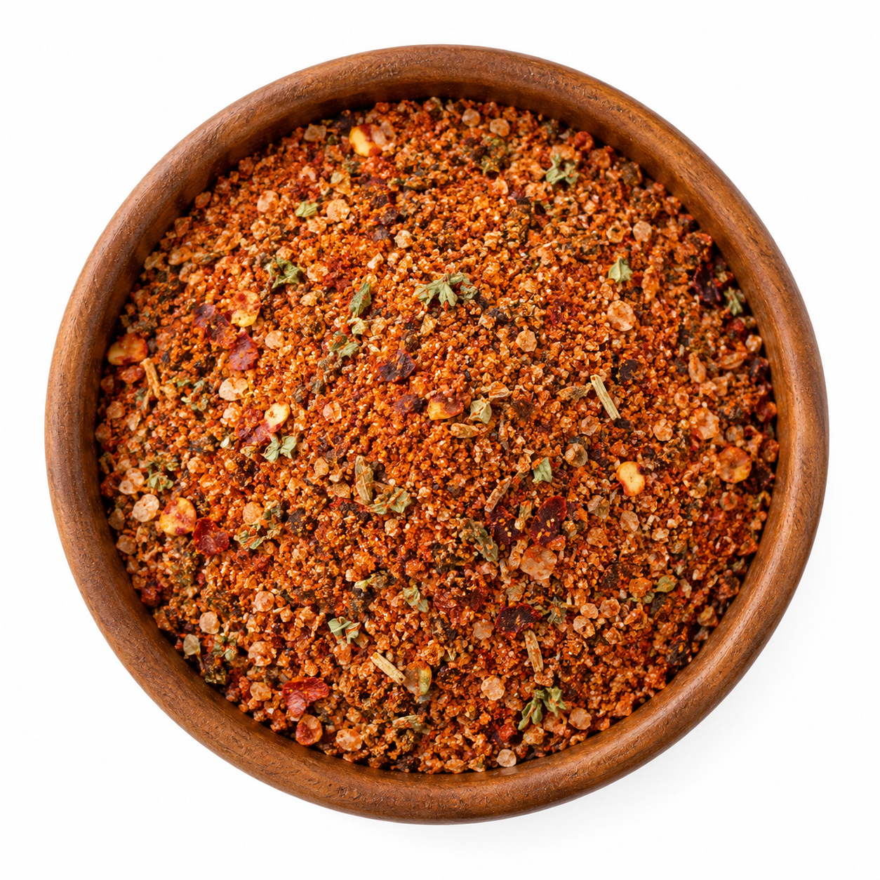 Spaanse-BBQ-rub-vervangfoto - Kruidenkaravaan Spaanse BBQ-rub in een rond houten schaaltje op witte achtergrond