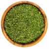 Zaatar groen - Kruidenkaravaan Zaatar groen in een ronde houten kom op een witte achtergrond.